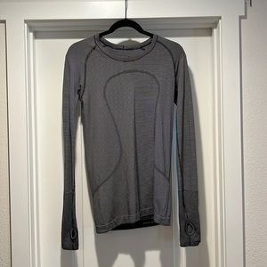 Lululemon long sleeved workout top, size 8. Black and white striped